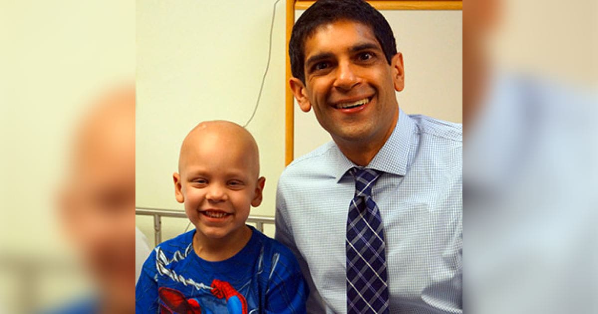 Dr. Rishi Lulla with a childhood cancer patient