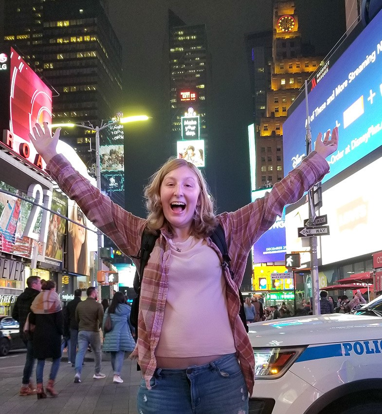 girl smiling in Times Square