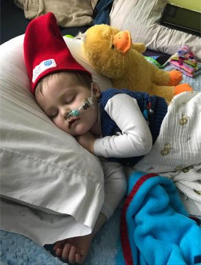 Hudson in hospital bed.