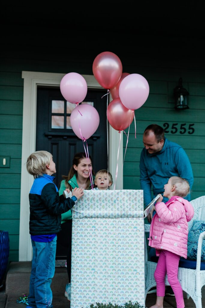 Danica and family with pink balloons for baby sister's gender reveal