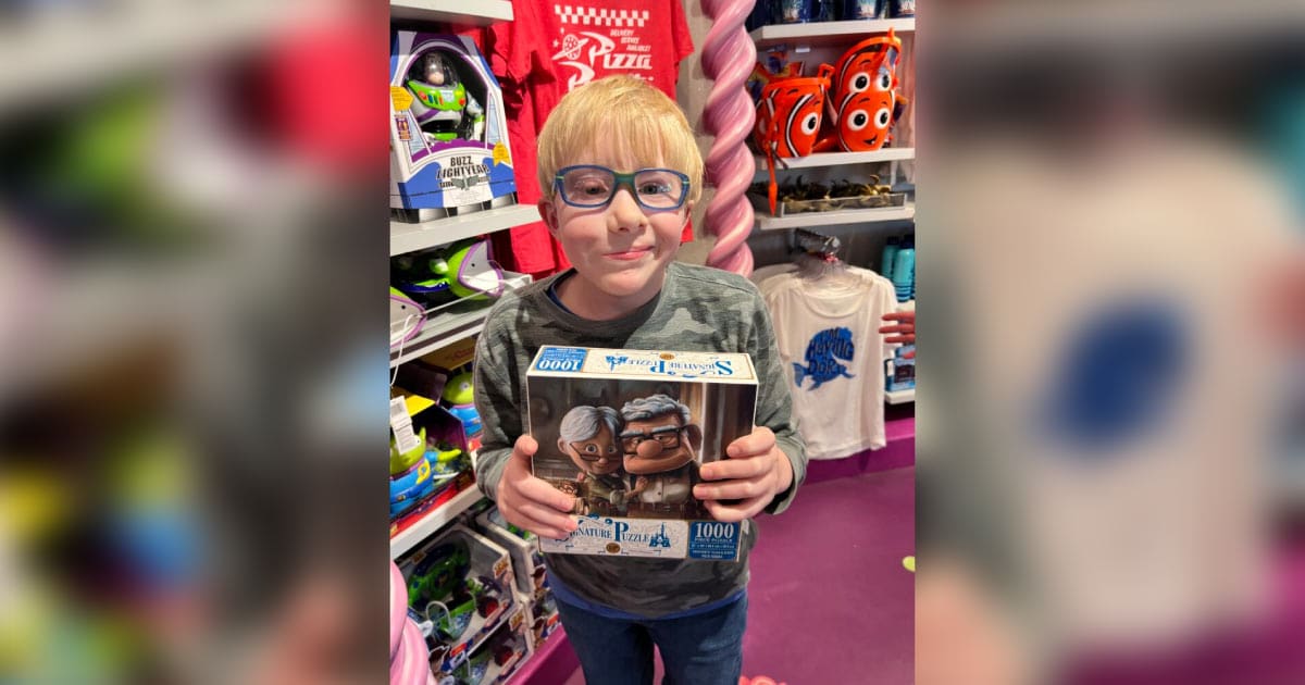 Jonah holding a toy at the store