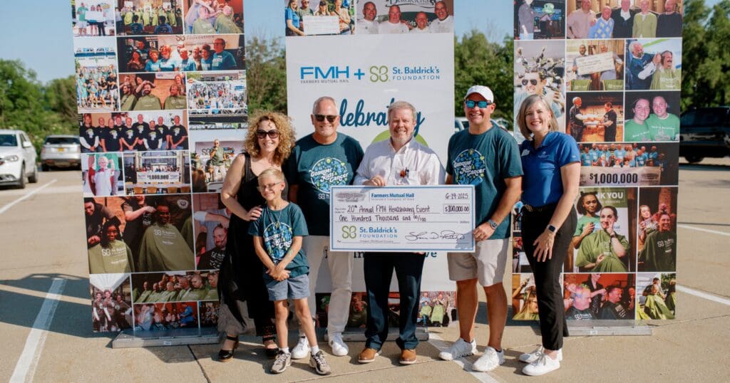 A group of six people smiling outdoors, holding a large check for $100,000 from FMH for St. Baldrick's Foundation. Collage of event photos in the background.