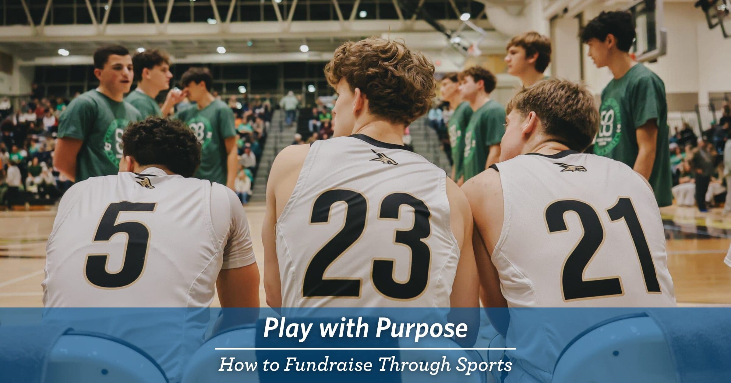 Three basketball players in jerseys numbered 5, 23, and 21 sit on a bench, facing players in green shirts. Text overlay reads "Play with Purpose: How to Fundraise Through Sports."